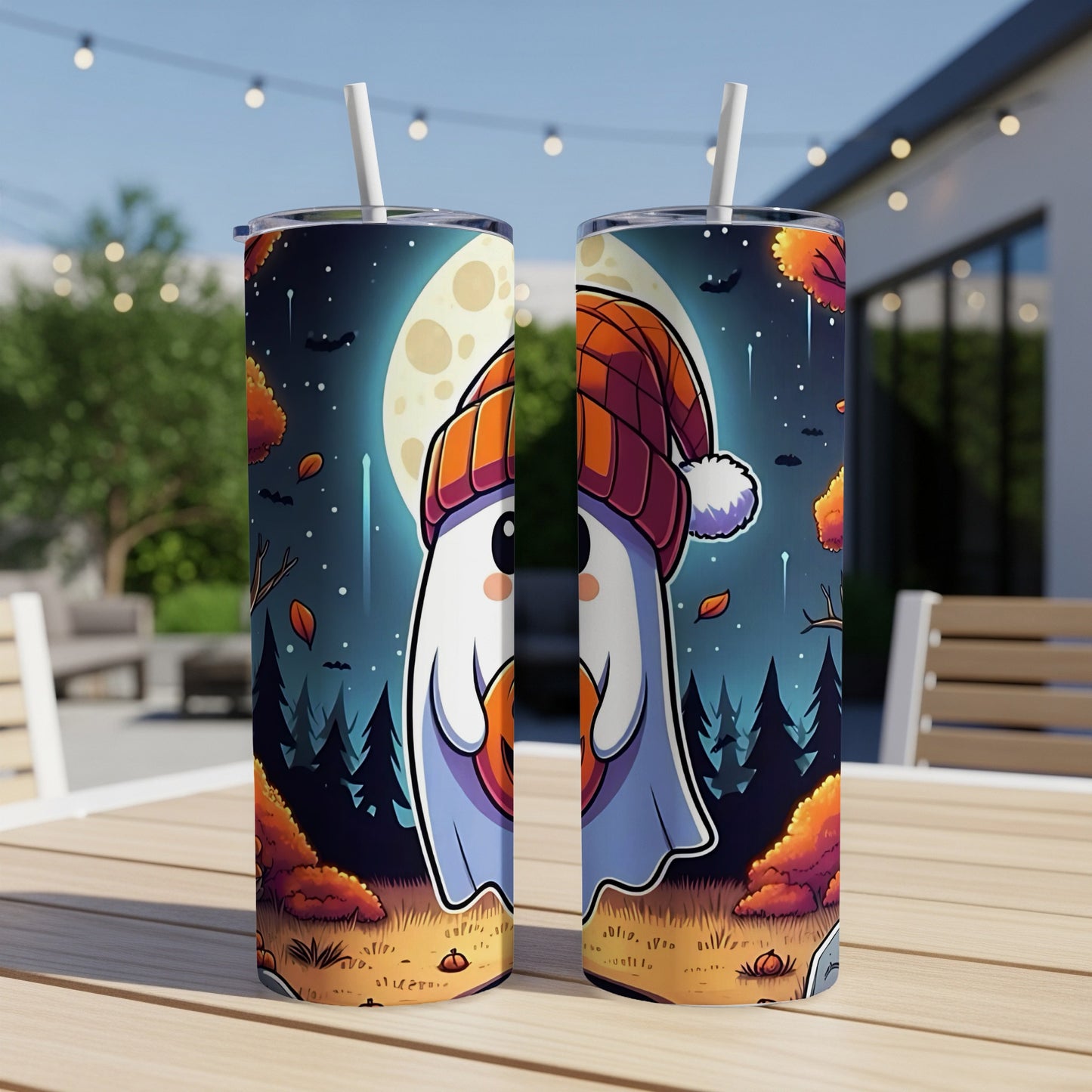 Two tumblers with a Halloween ghost design, sitting on a wooden table.
