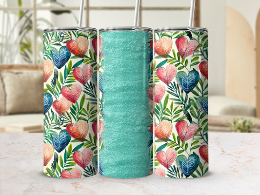 Three tall tumblers with a pink and blue heart floral pattern.