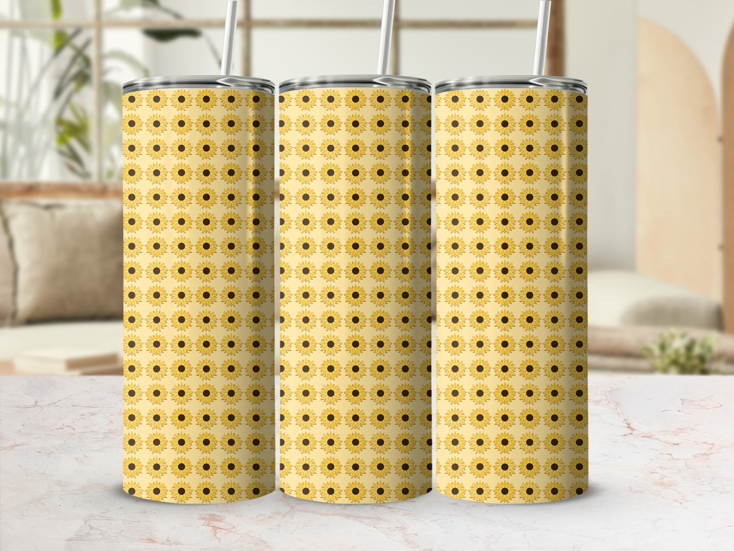 Three tall tumblers with a repeating sunflower pattern.