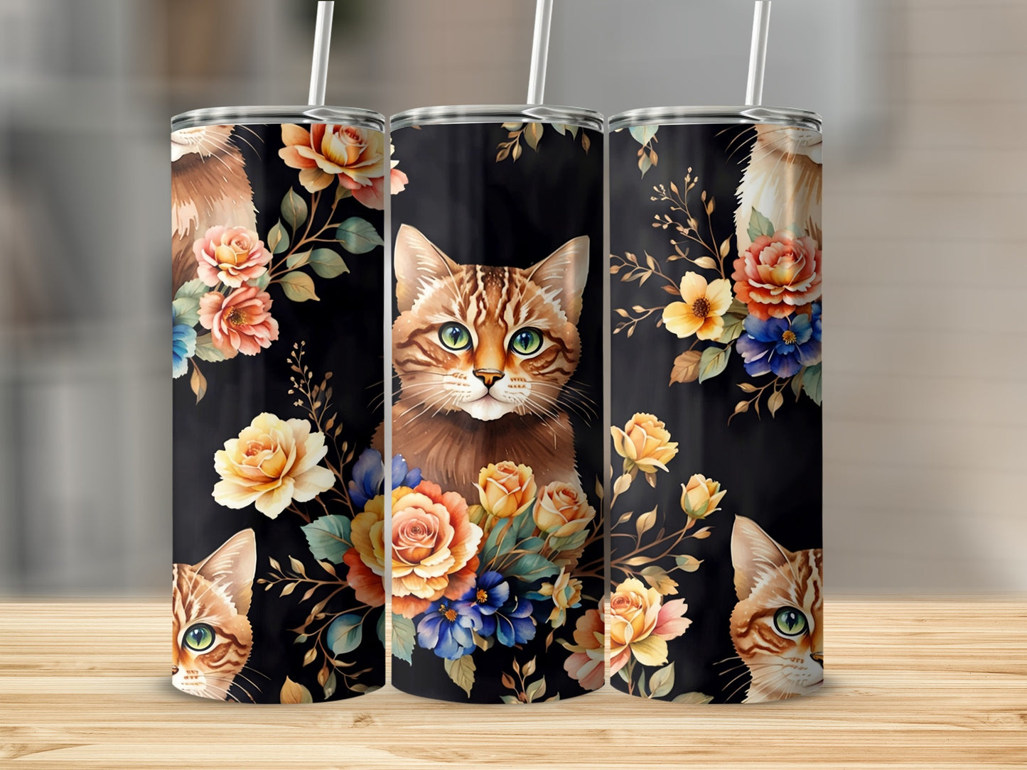 Three tumblers featuring a tabby cat's face and floral illustrations on a black background.