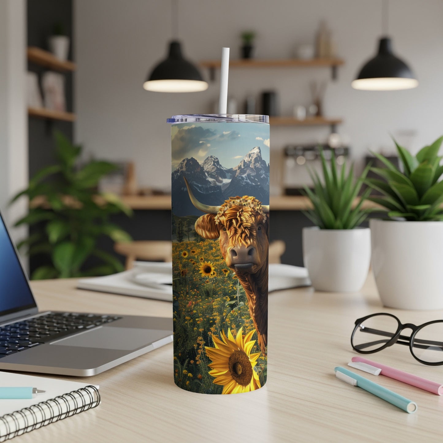 Highland cow in a sunflower field on a patterned tumbler.