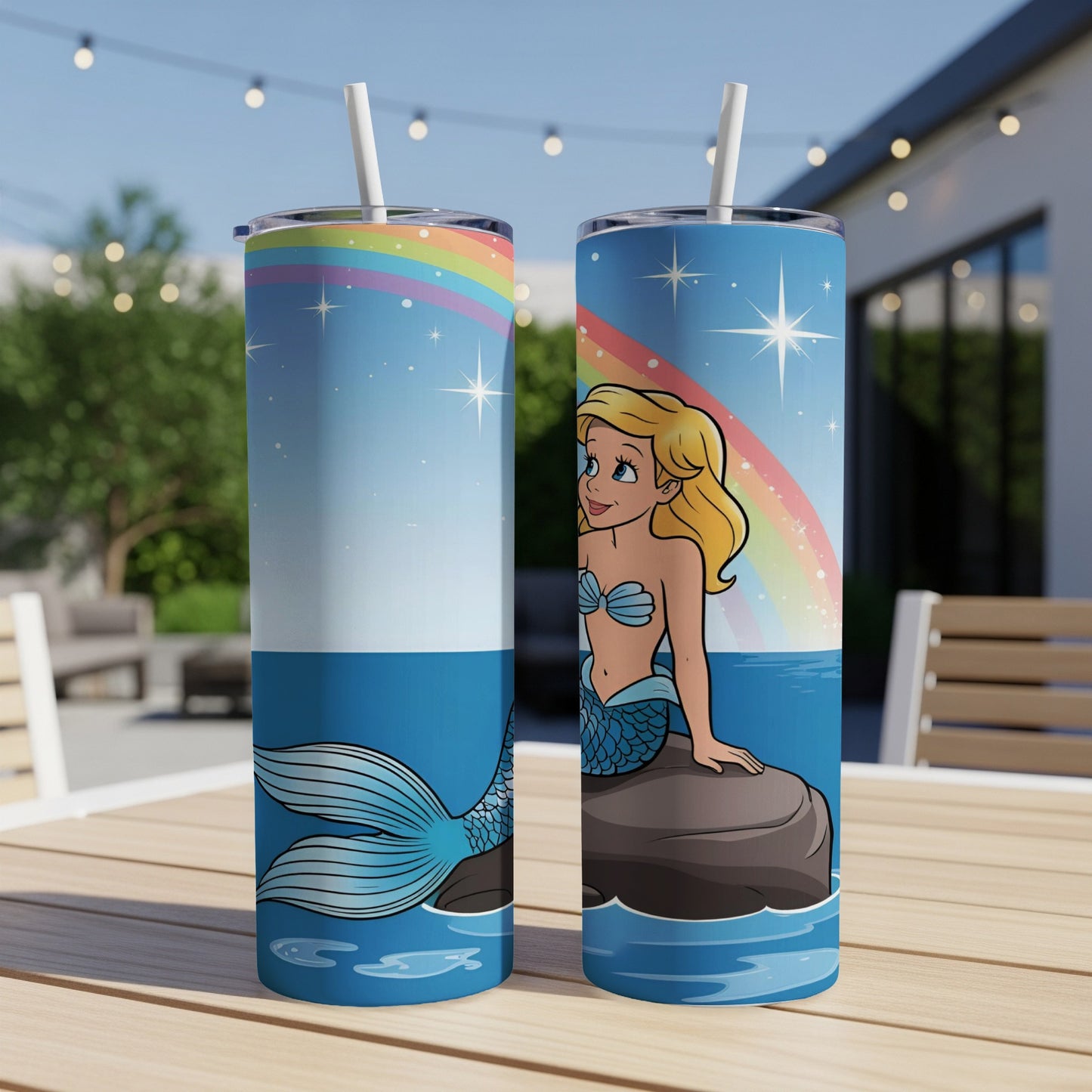 Two mermaid tumblers with a whimsical scene.