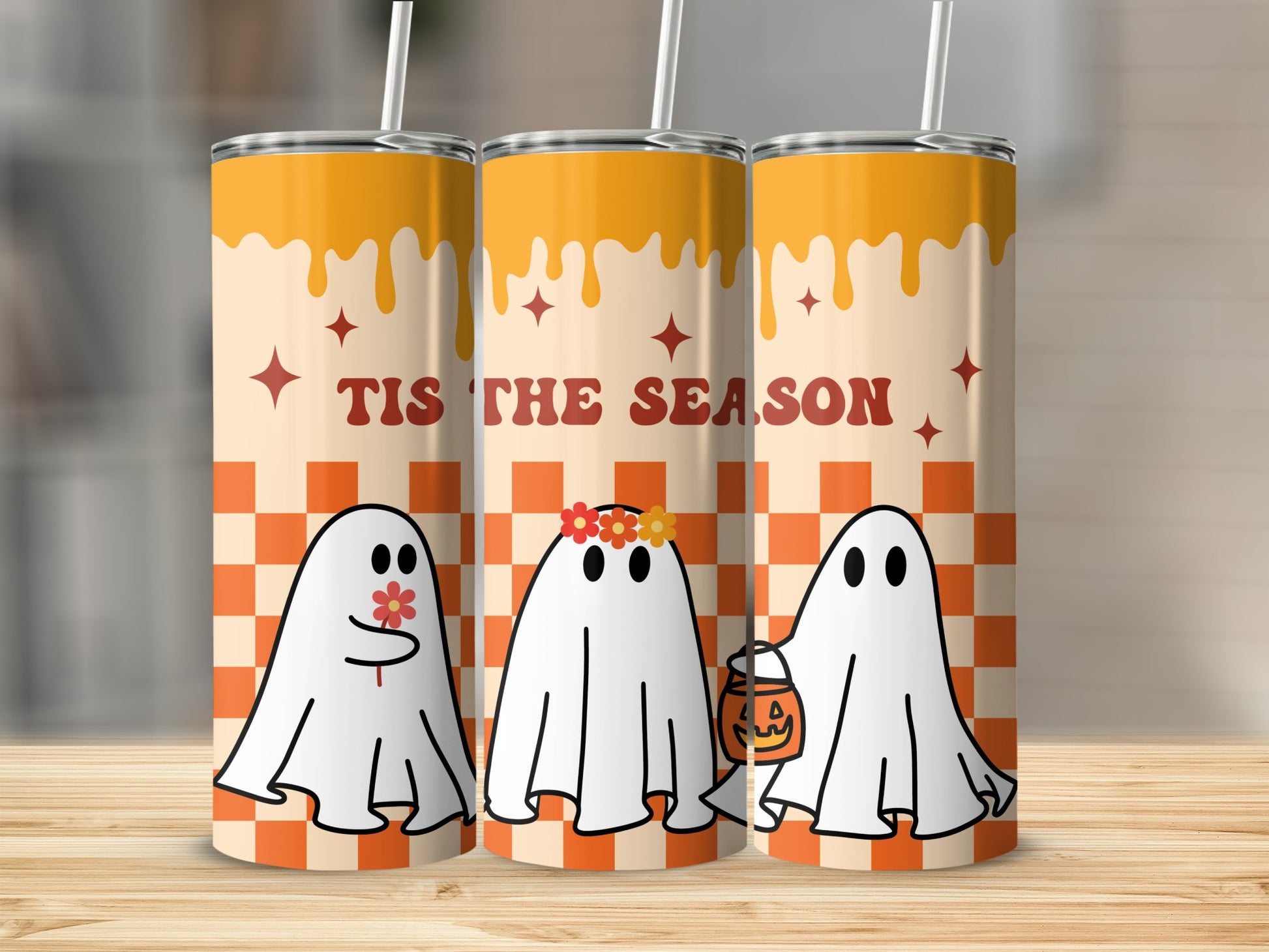 Three tumblers with ghosts, flowers, and "Tis the Season" text on a checkerboard background.