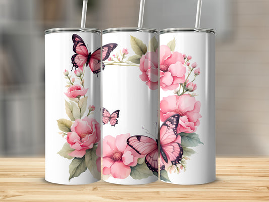 Three white tumblers decorated with pink flowers and butterflies.
