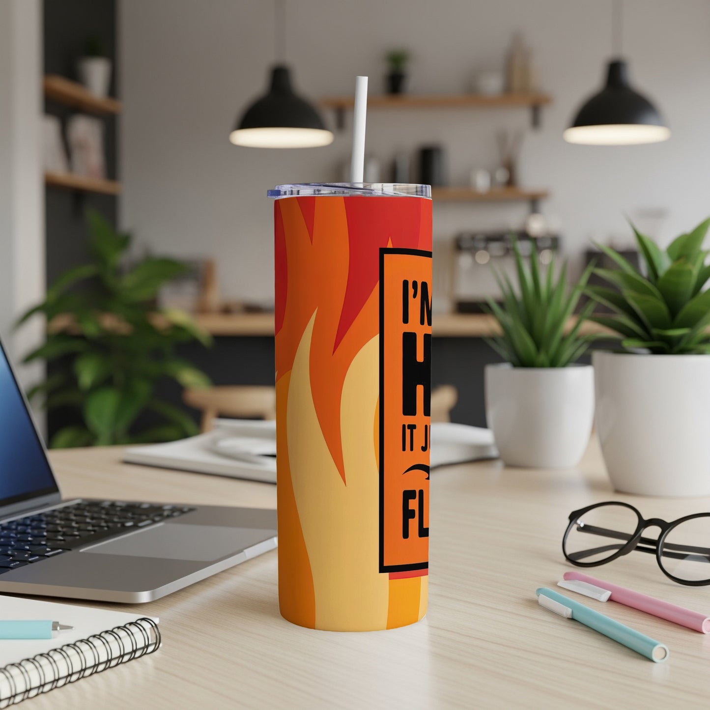 Orange and yellow flame tumbler with "I'M GONNA HUG IT OUT" text.