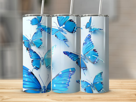 Three tumblers with blue butterflies on a white background.