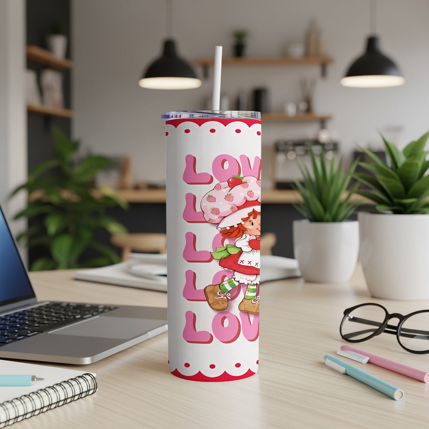 Strawberry Shortcake pattern on a white tumbler with a straw.
