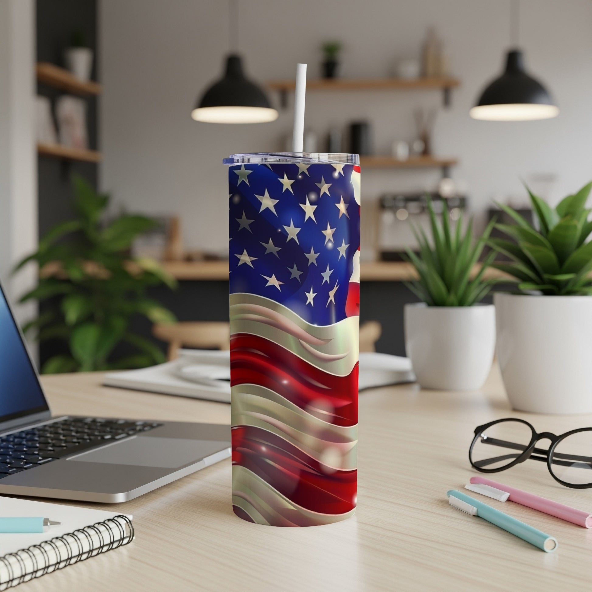 American flag pattern on a silver and red striped tumbler with a white straw.