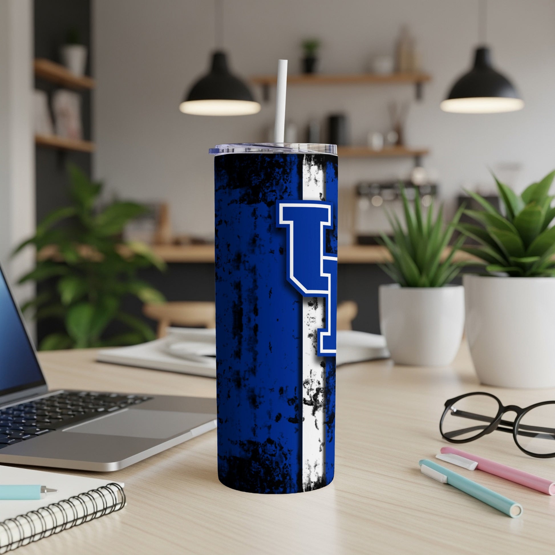 Blue distressed tumbler with white stripe and large "UK" logo.