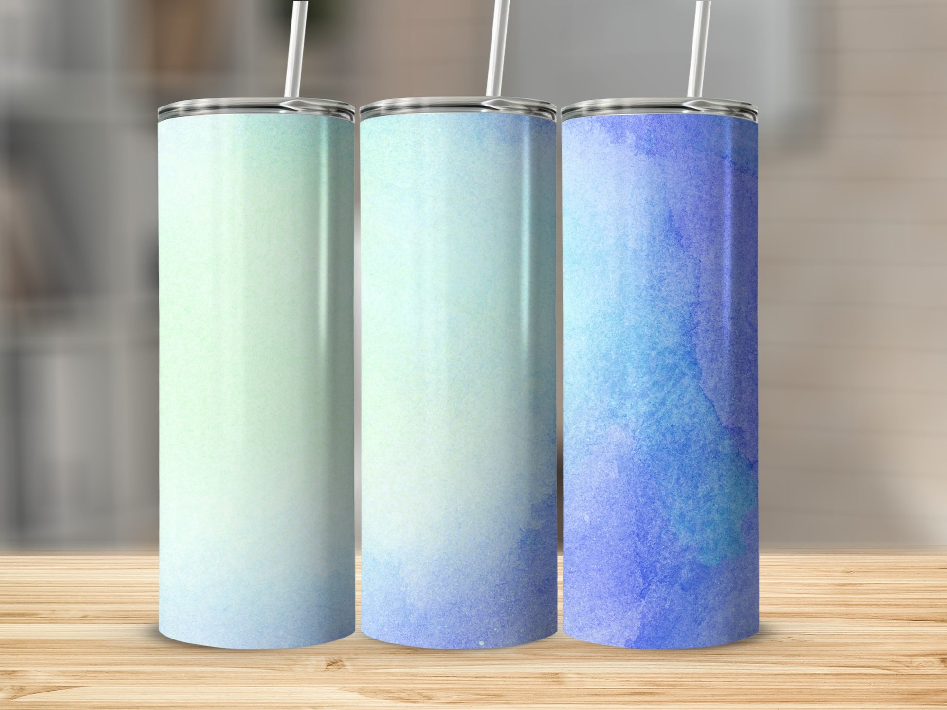 Three tumblers with watercolor gradients from green to blue.