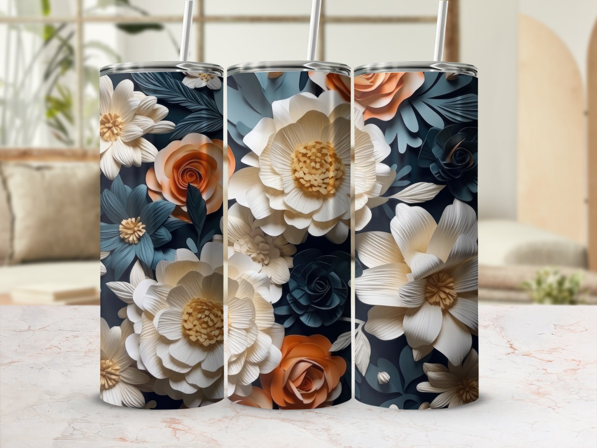 Three tumblers with floral patterns in white, orange, and navy blue.