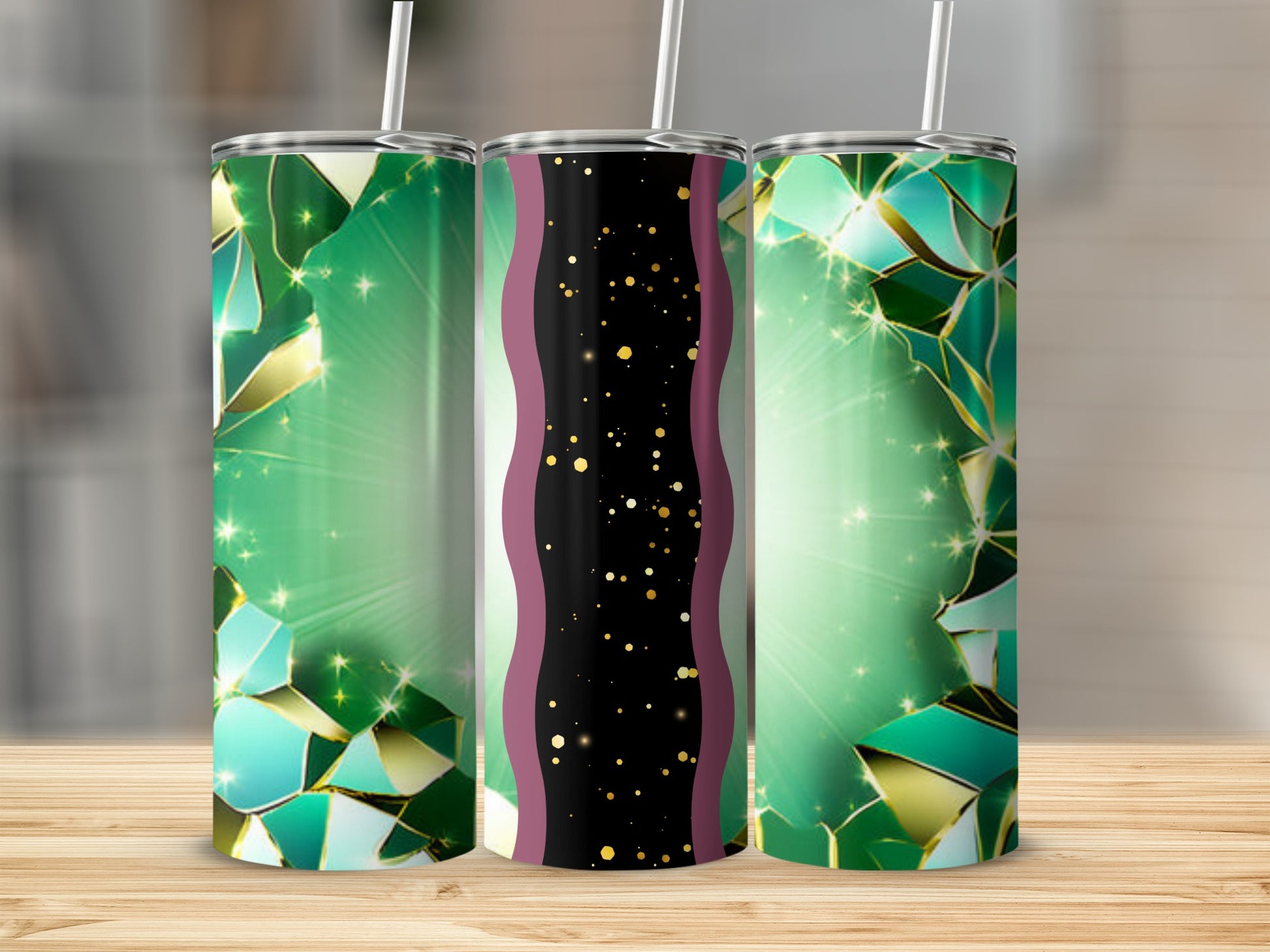 Three tall tumblers with green, gold, and black geometric designs.