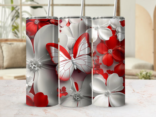 Three tumblers with red and white floral designs and a butterfly.