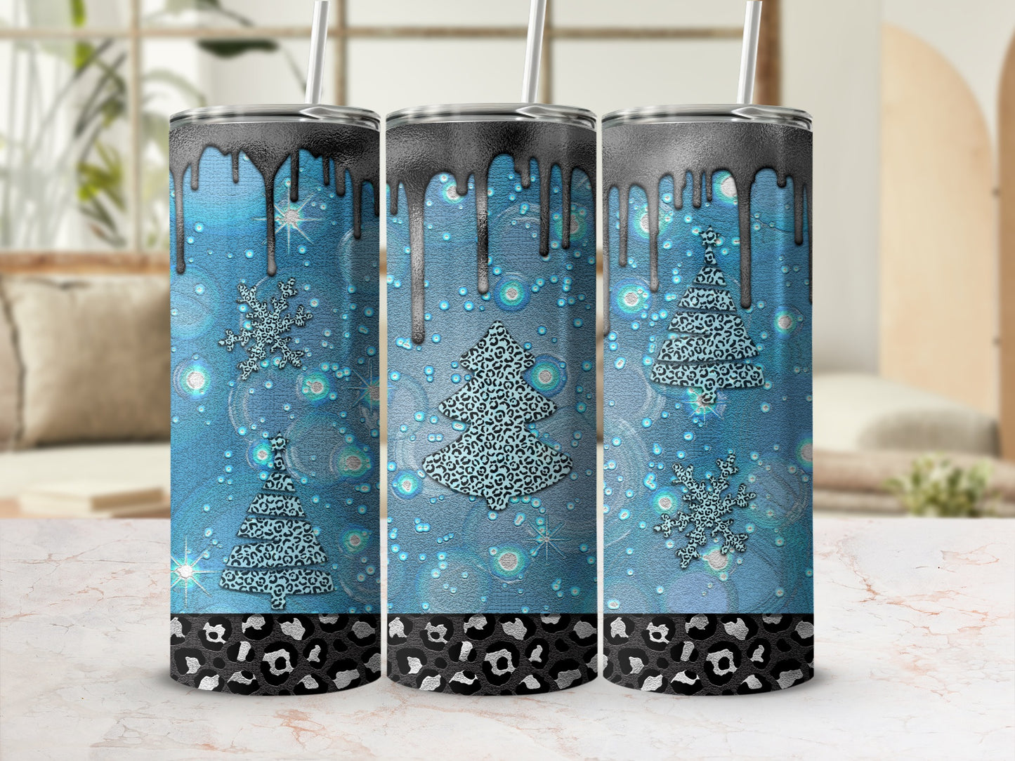 Three sparkling blue tumblers with leopard print bands and dripping black tops.