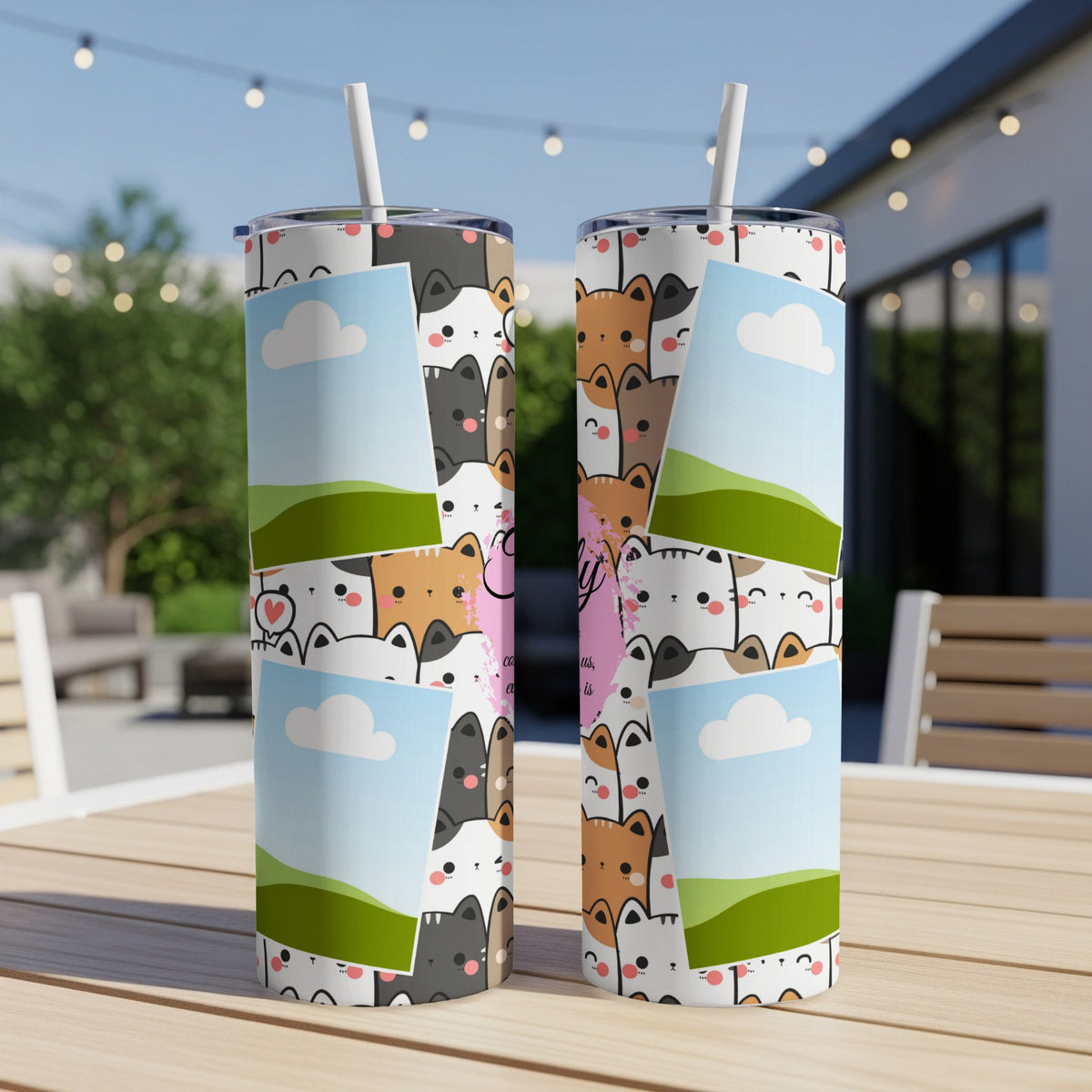 Two tumblers with a cute cat pattern and photo frame inserts, outdoors.