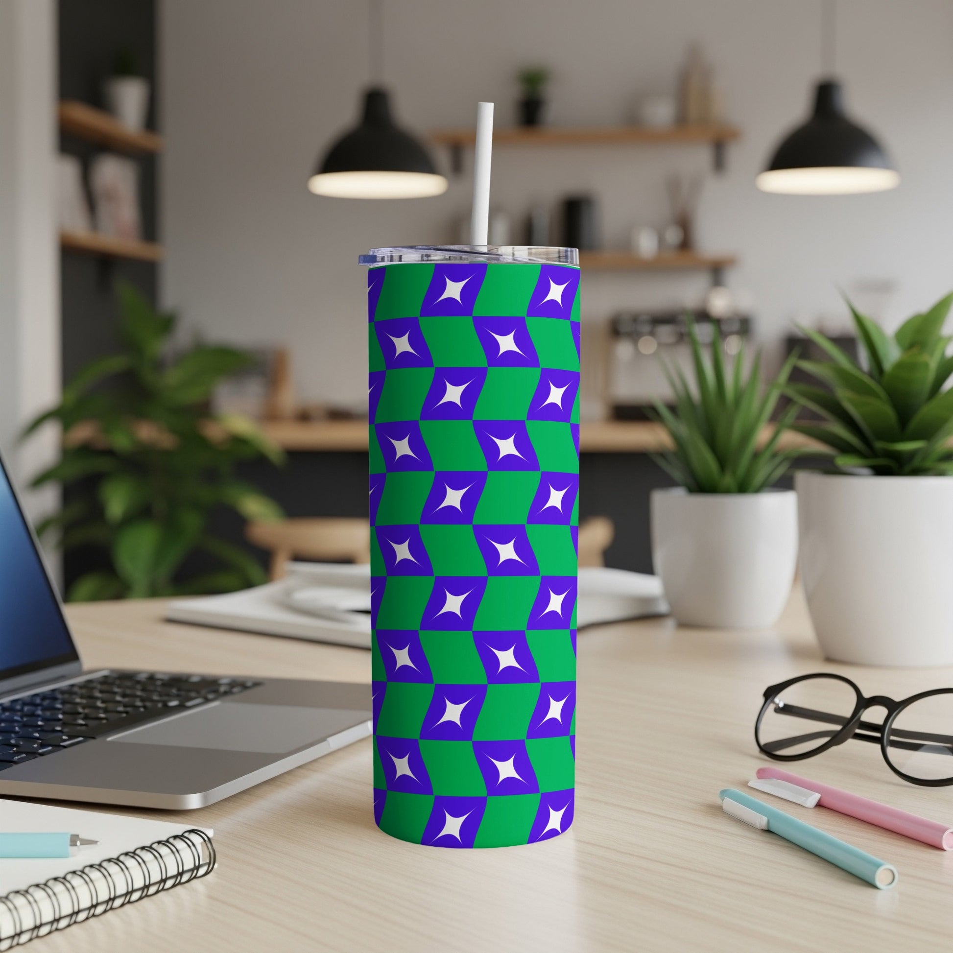 Purple and green geometric tumbler with a white straw.