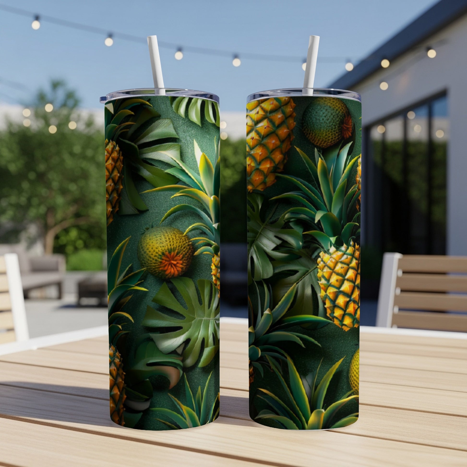 Two tumblers with a tropical pineapple and monstera leaf pattern.