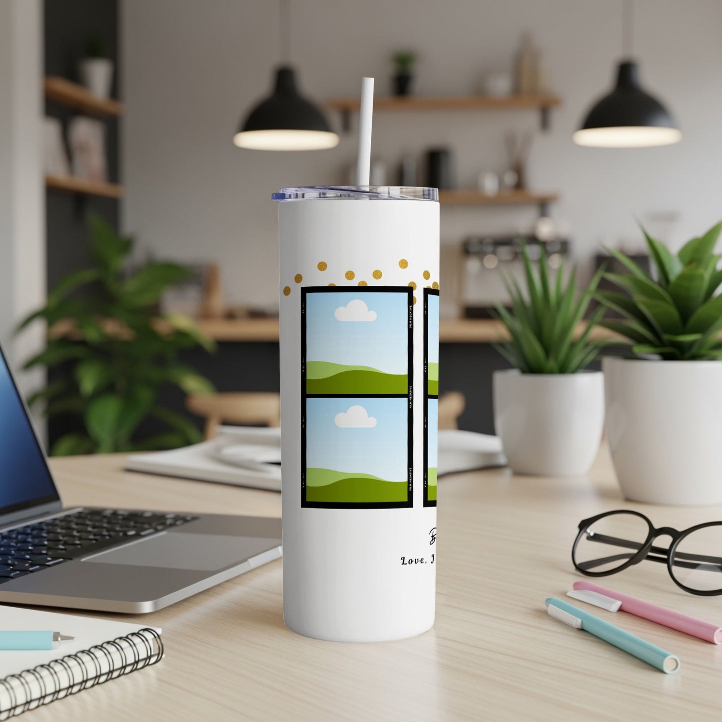 White tumbler with gold polka dots, film strip design, and cursive text.