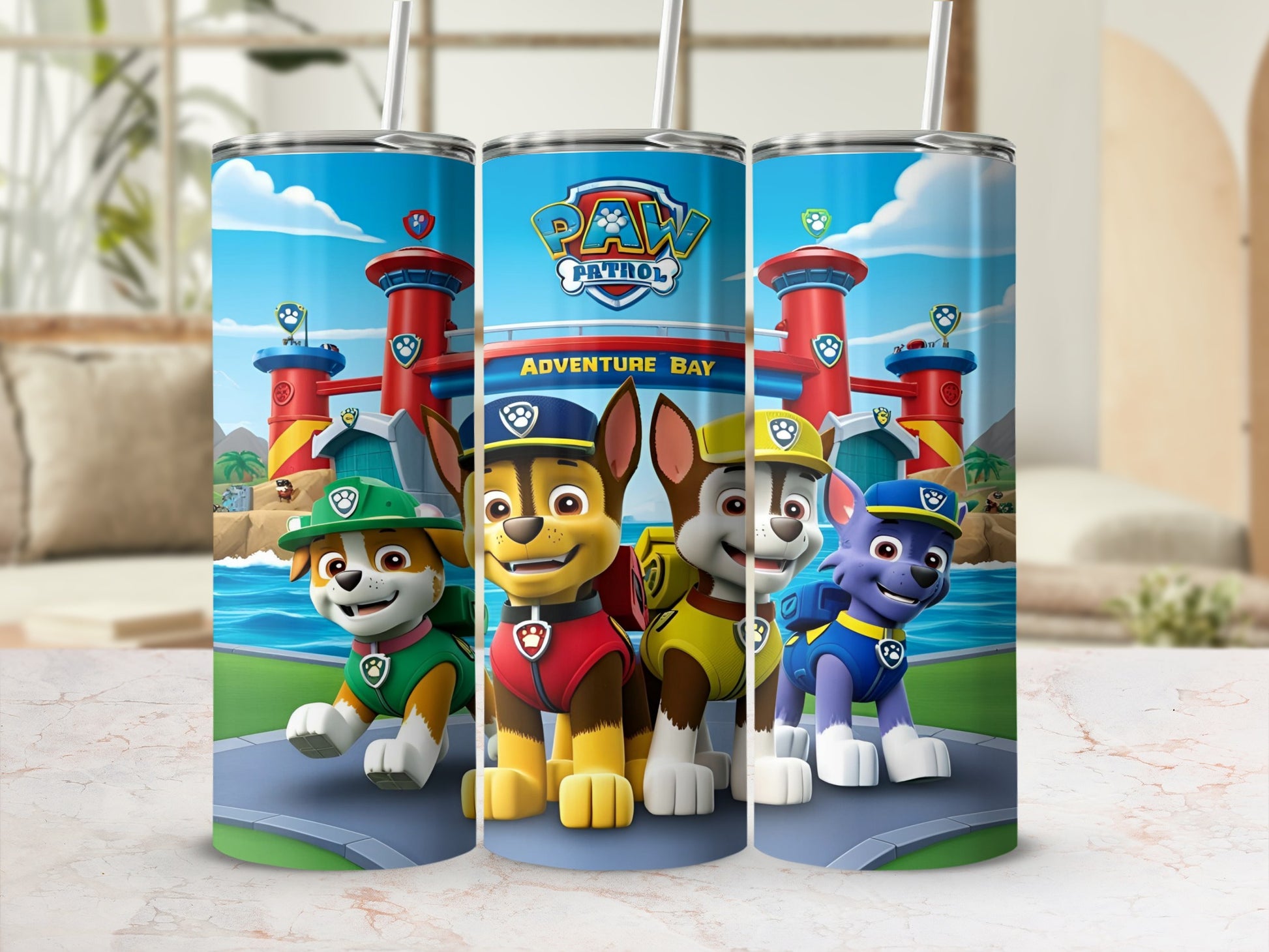 Paw Patrol characters Chase, Marshall, and Rubble stand in front of Adventure Bay.