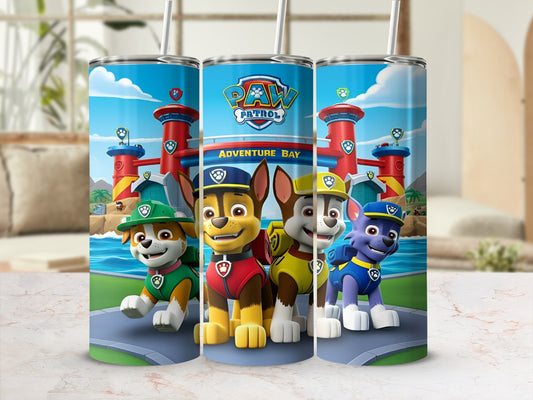 Paw Patrol characters Chase, Marshall, and Rubble stand in front of Adventure Bay.