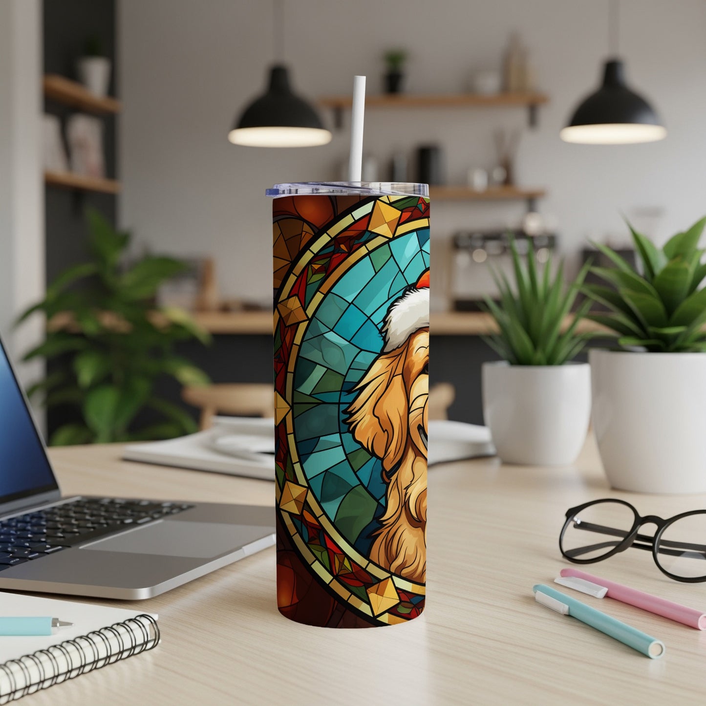 Golden Retriever wearing Santa hat on stained glass tumbler with straw.