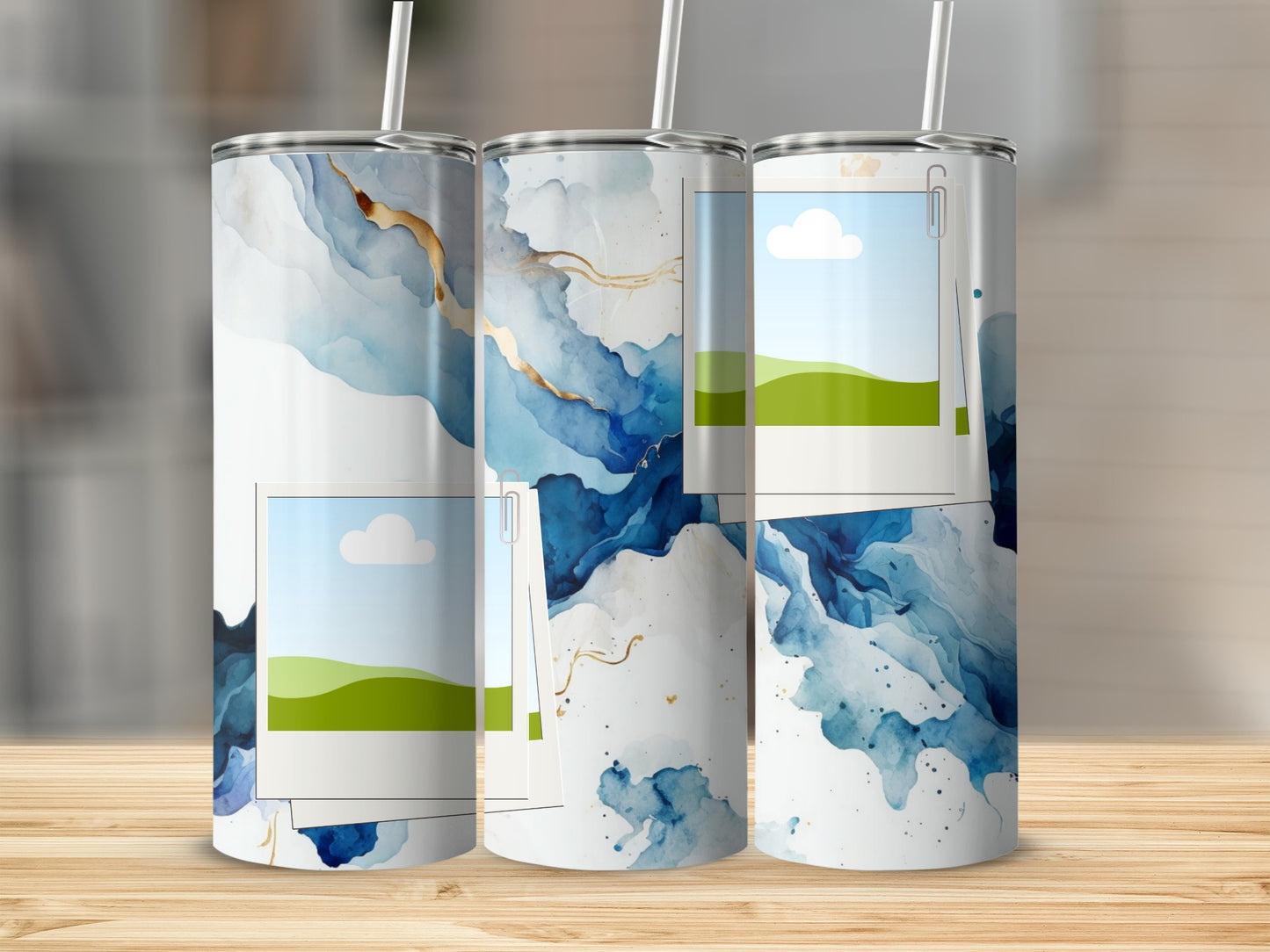 Tumblers with blue abstract watercolor design and polaroid frame accents.