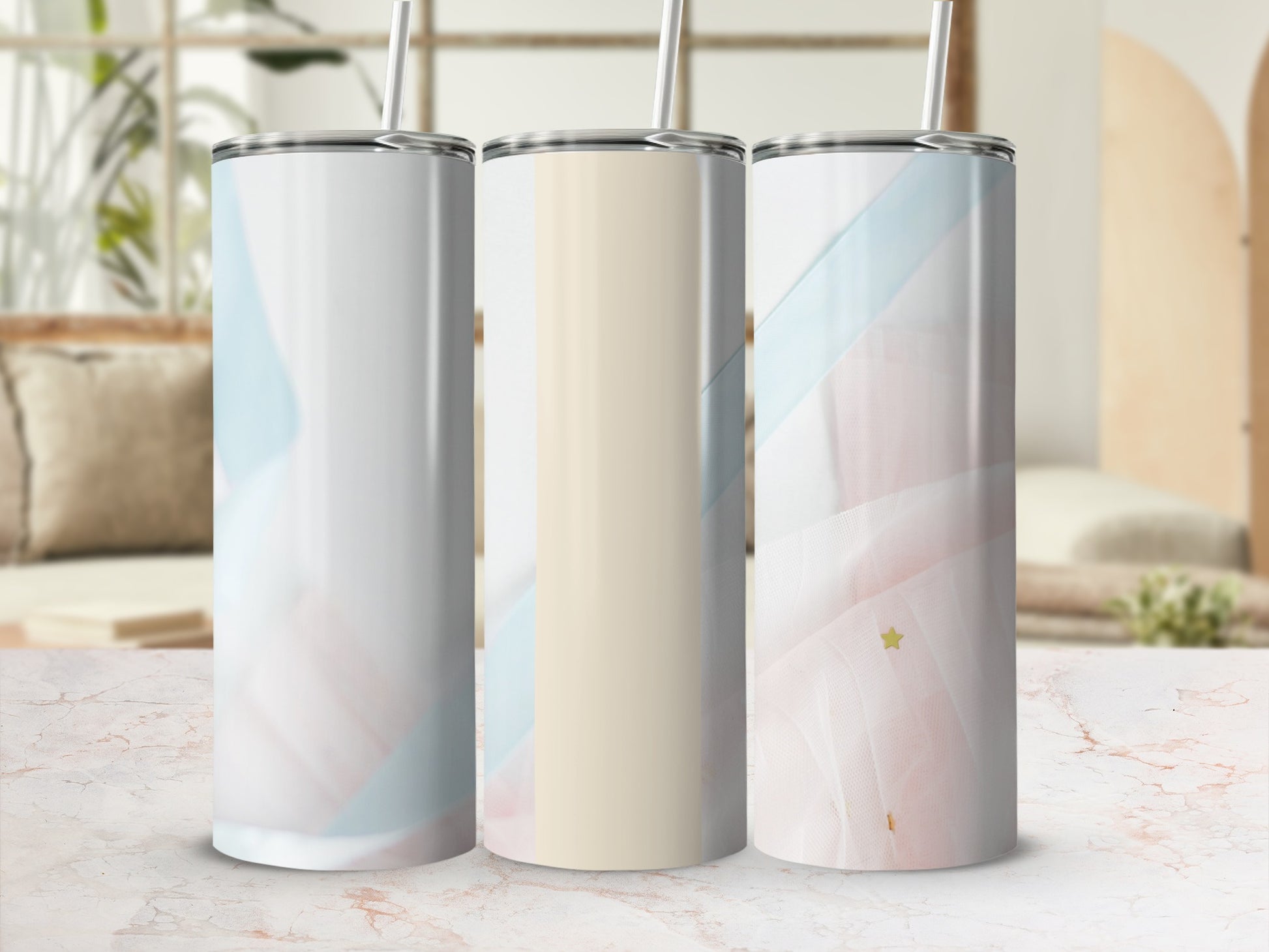 Three tall, skinny tumblers with a soft, abstract watercolor pattern and straws.