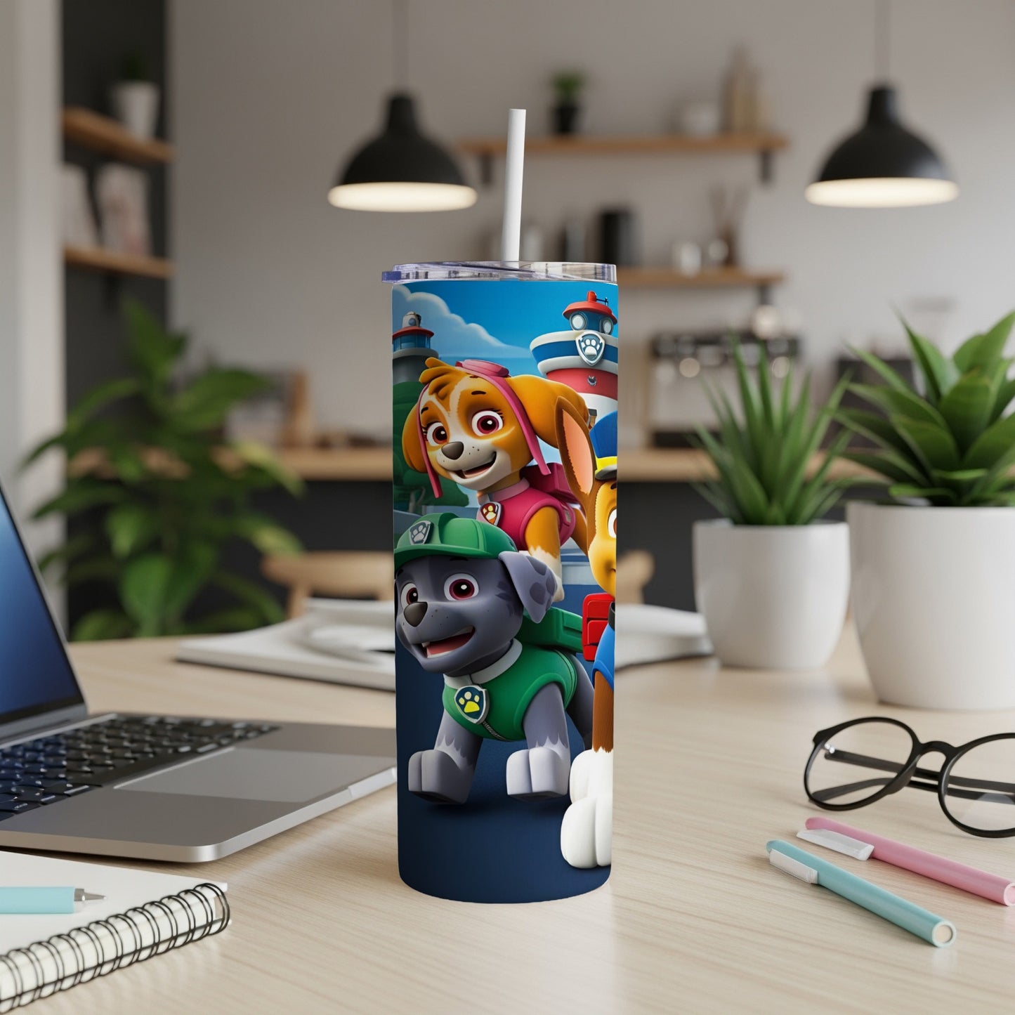 Paw Patrol characters Skye and Chase on a blue tumbler with a white straw.