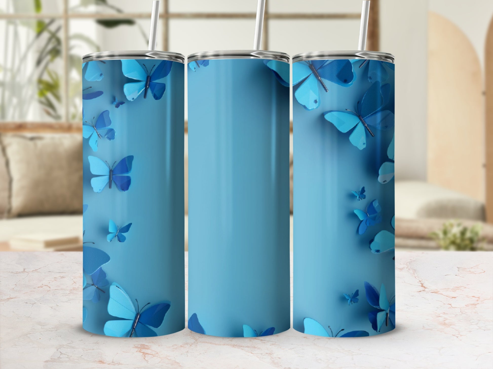 Blue tumbler with repeating butterfly pattern and straw.