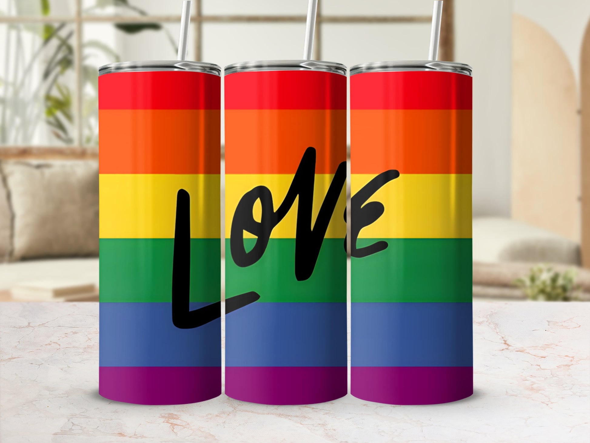 Rainbow striped tumbler with "love" in black script.