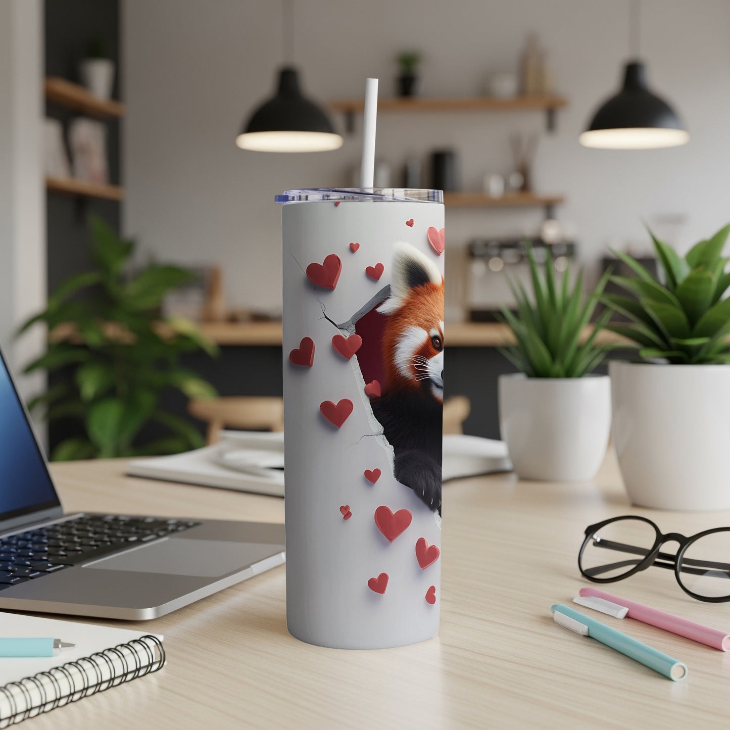 White tumbler with red panda emerging from torn heart pattern.