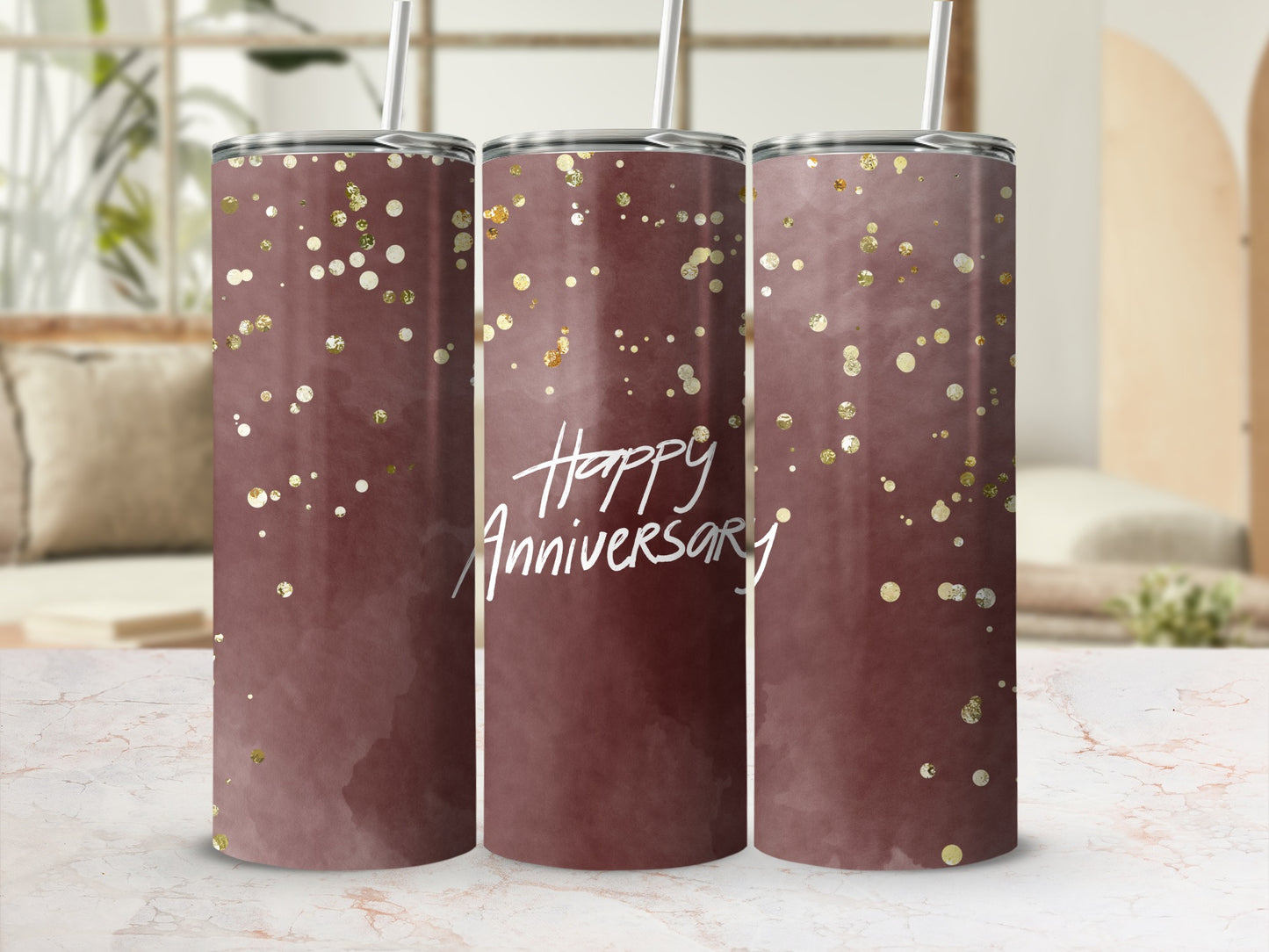 Maroon tumbler with gold glitter and "Happy Anniversary" text.