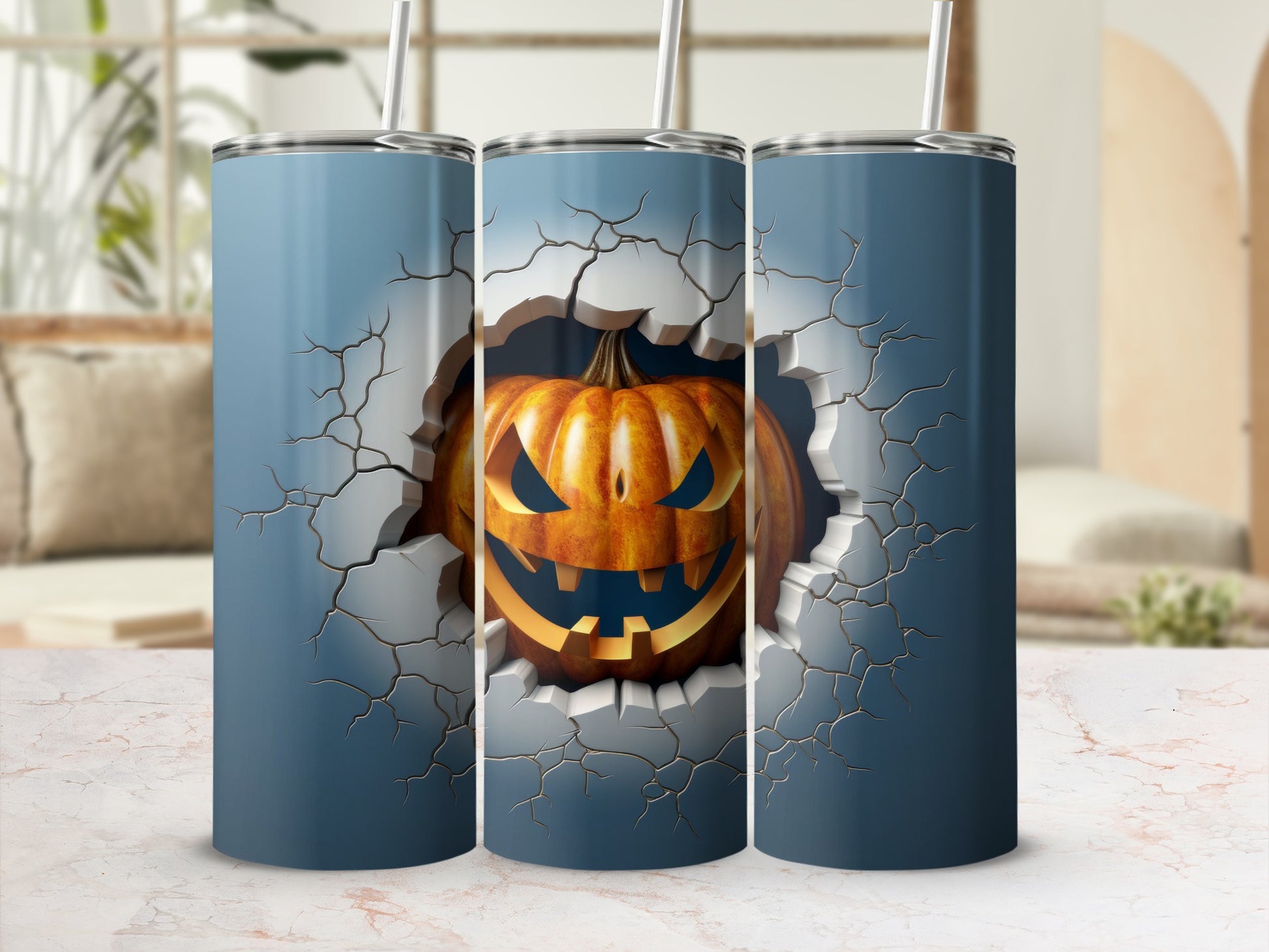 Three tumblers with a cracked surface revealing a jack-o'-lantern design.