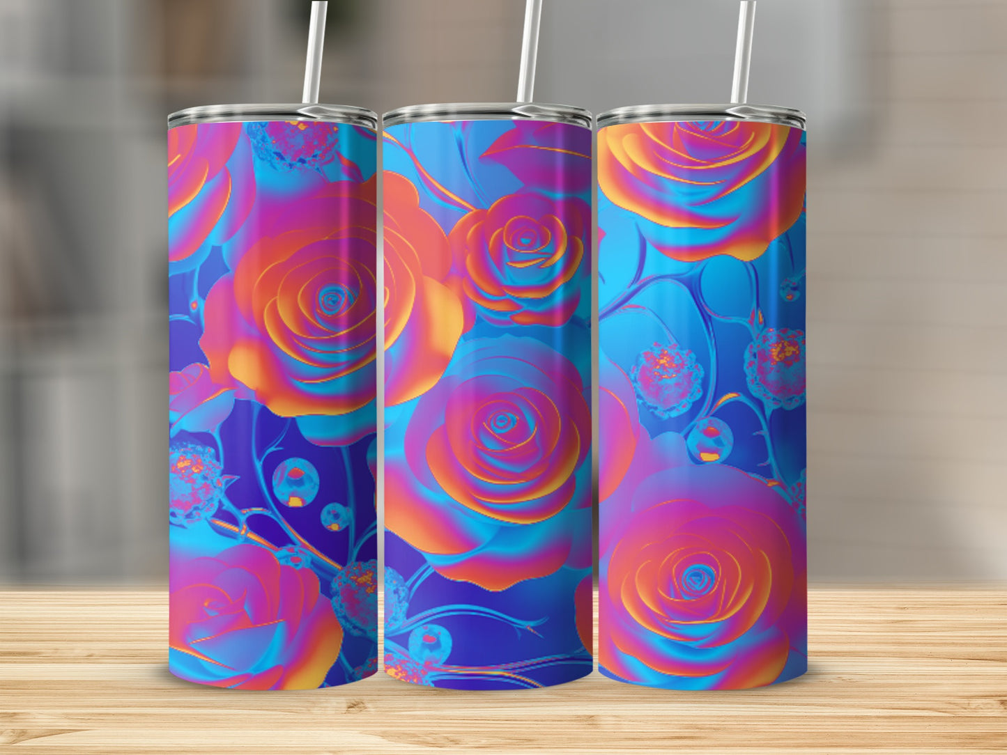 Three tumblers with a vibrant rose pattern and straws.