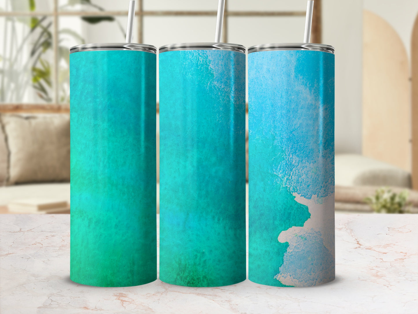 Three stainless steel tumblers with turquoise and white watercolor designs.
