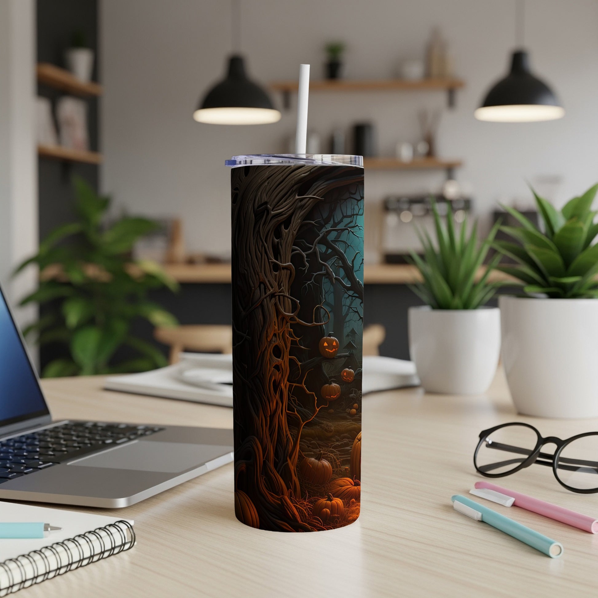 Tumbler with a spooky Halloween forest scene featuring pumpkins and gnarled trees.