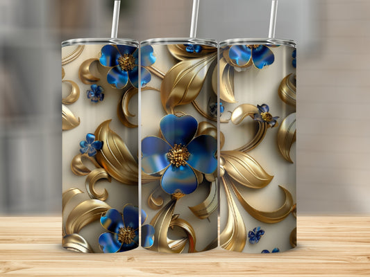 Three tumblers with gold floral designs and blue flowers.