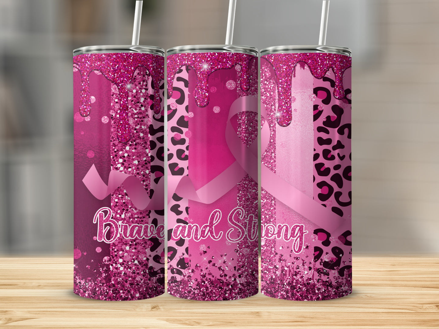 Pink glitter tumbler with leopard print and "Brave and Strong" text.