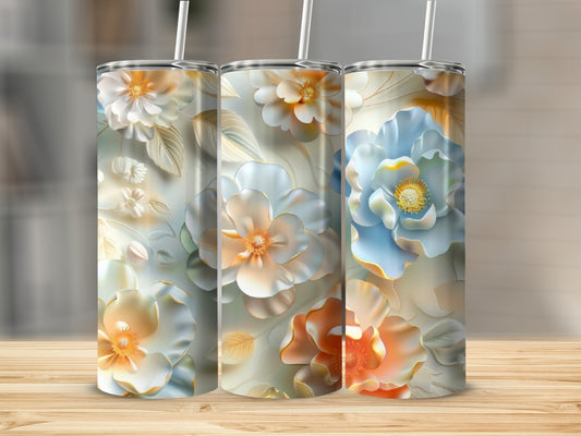 Three tumblers with a floral pattern of light blue, peach, and cream flowers.