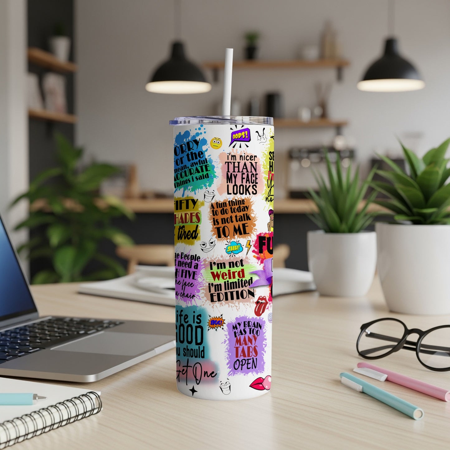 Tall tumbler with colorful, bold text designs and phrases.
