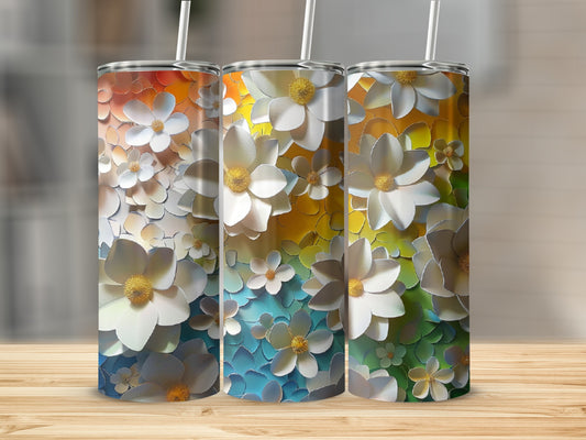 Three tumblers with white floral designs on a gradient background.