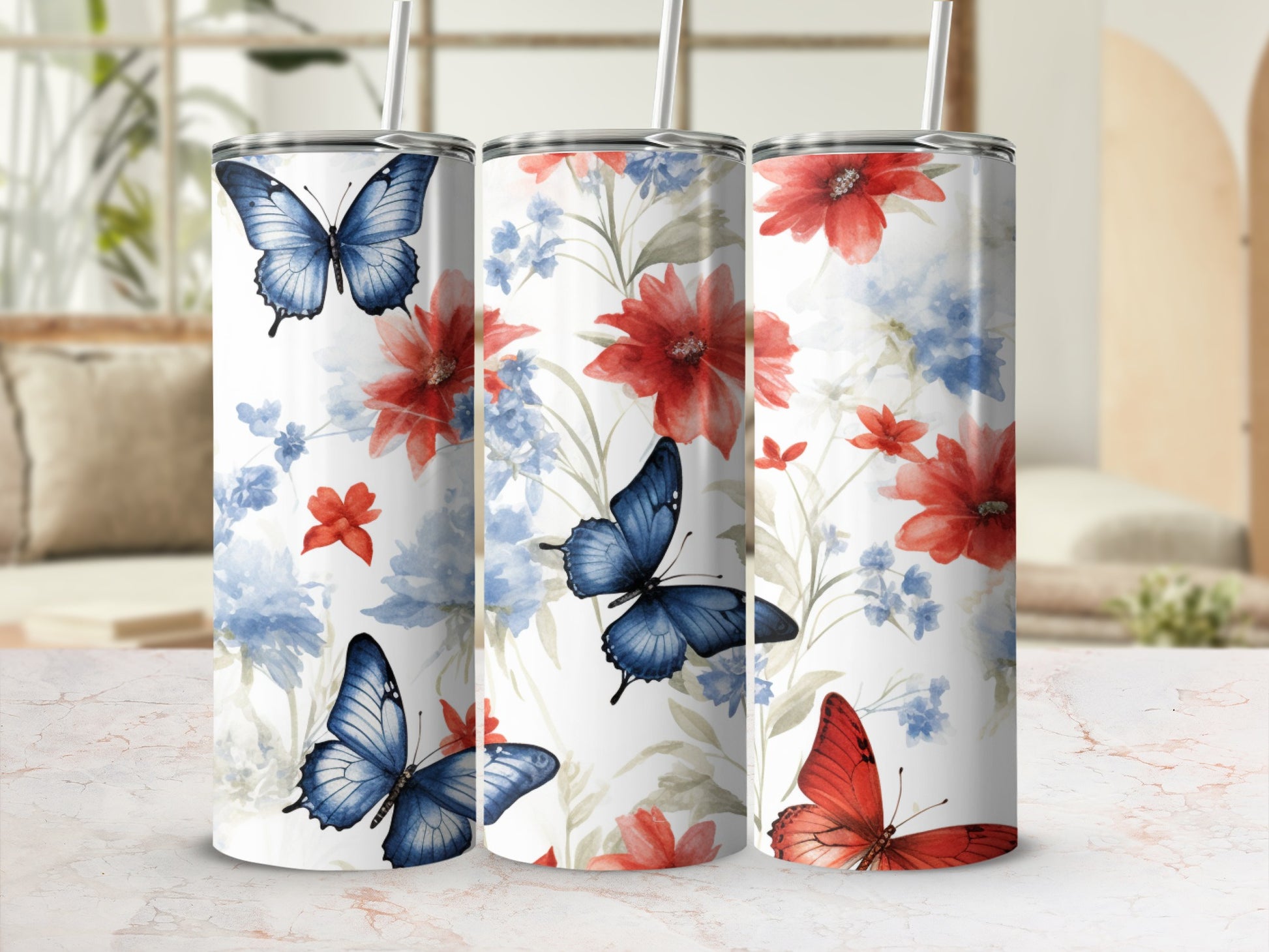 Three tumblers with a floral and butterfly design.