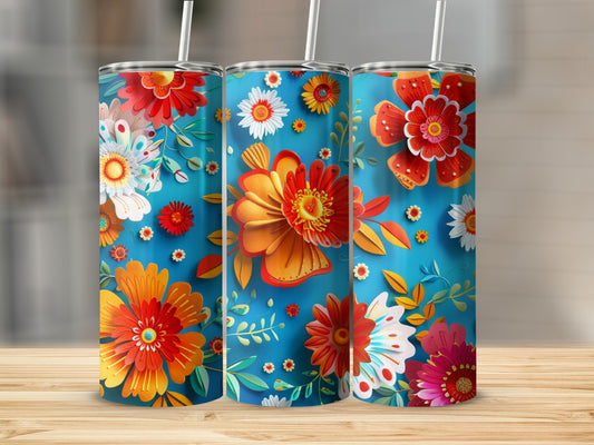 Three colorful floral patterned tumblers on a wooden surface.