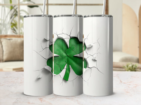 Three white tumblers with a green shamrock design breaking through the surface.