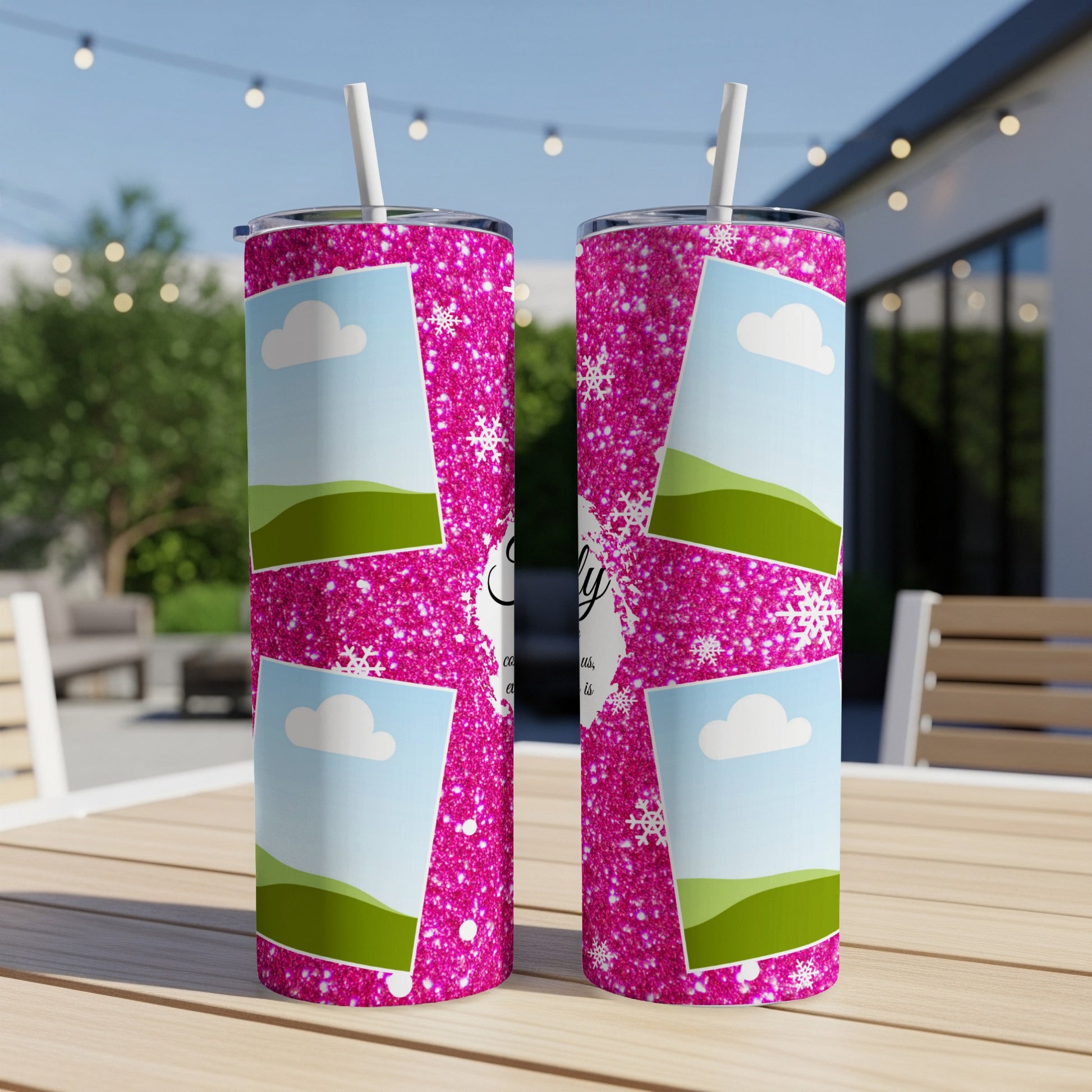 Two pink glitter tumblers with photo frames and snowflakes displayed outdoors.