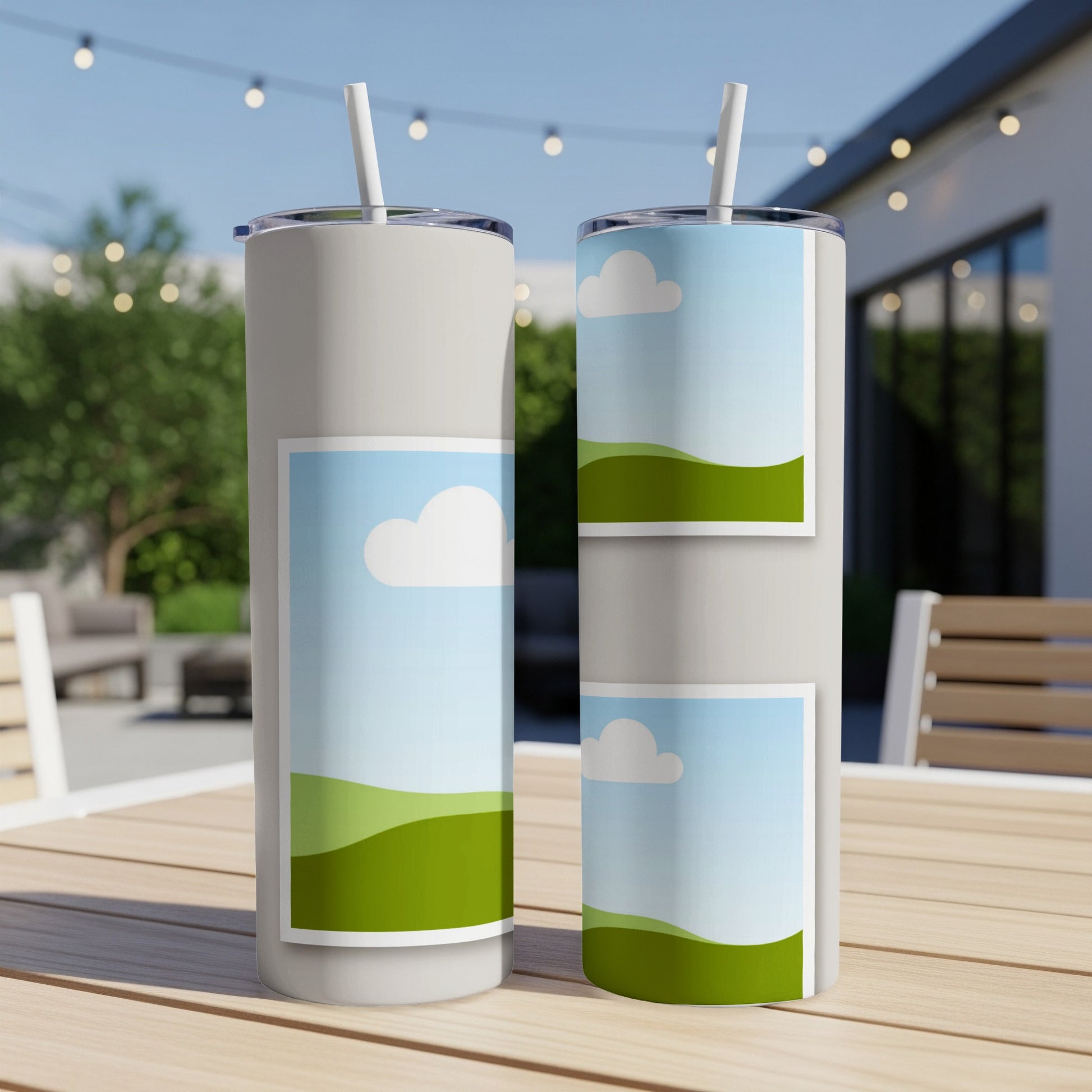 Two tumblers with straw on a wooden table, one with a full cloud design, the other with a split design.