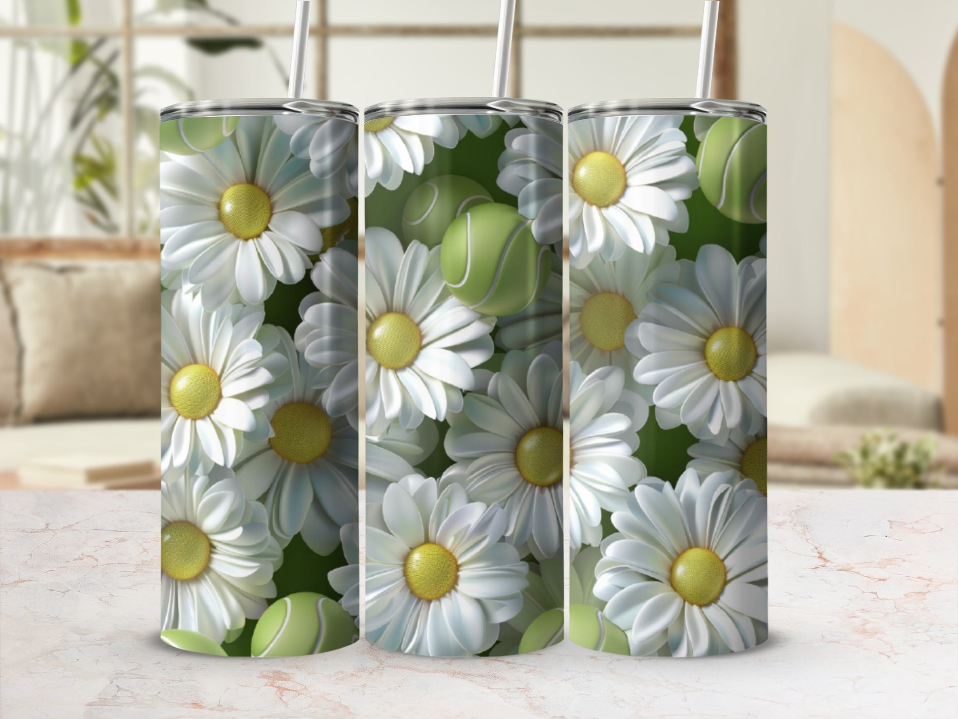 Three tumblers with a white daisy and green tennis ball pattern.