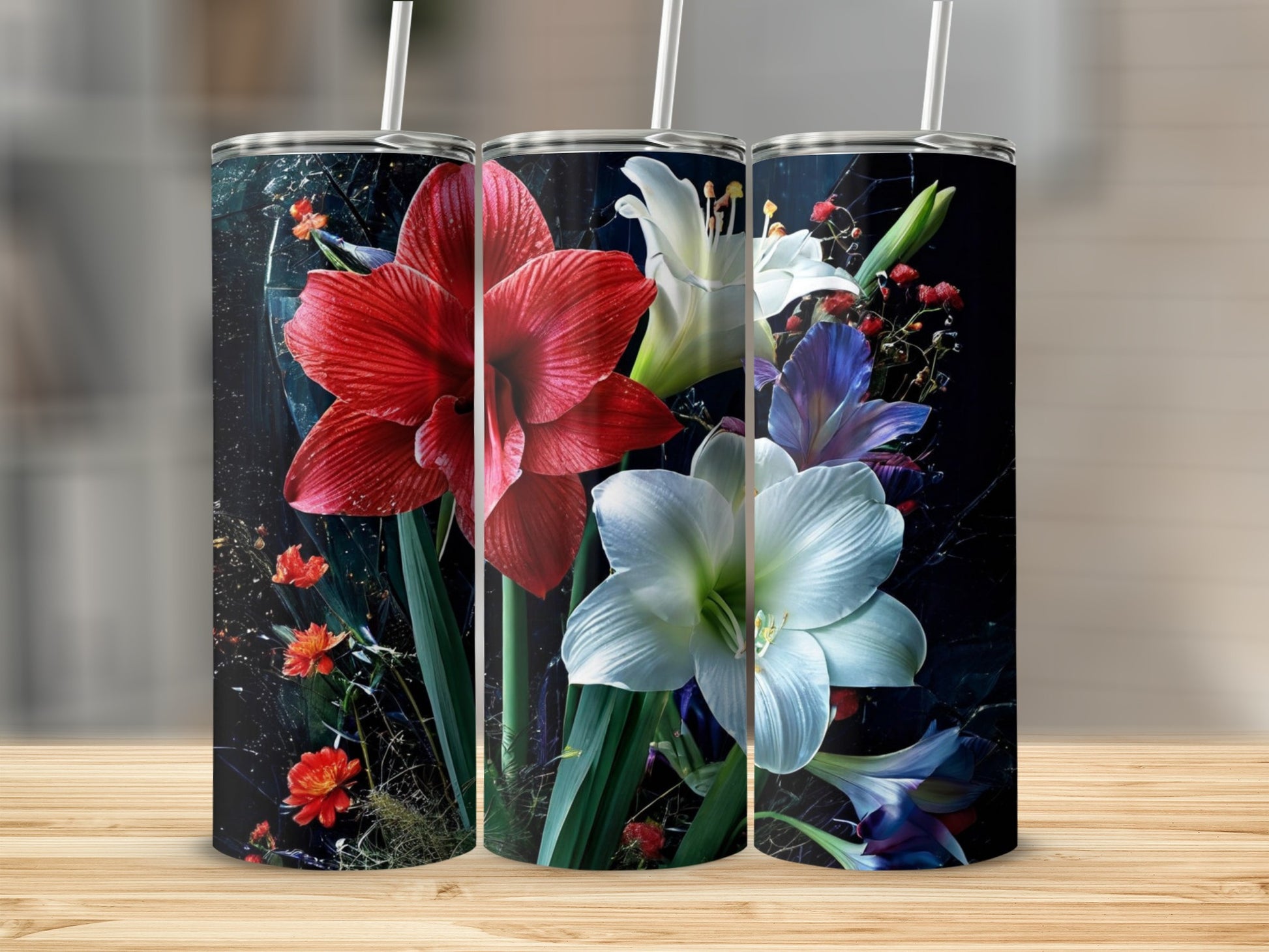 Three tumblers decorated with vibrant red and white amaryllis flowers.