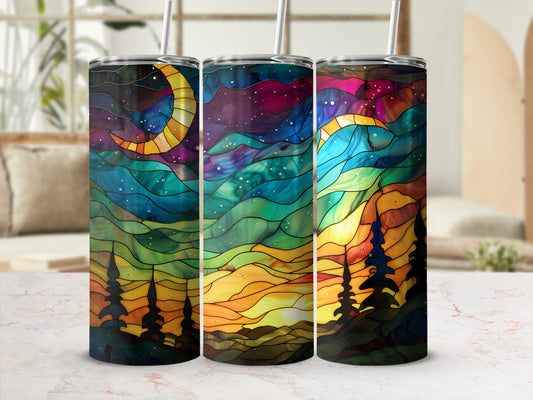 Three stained glass tumblers with celestial and forest scene designs.