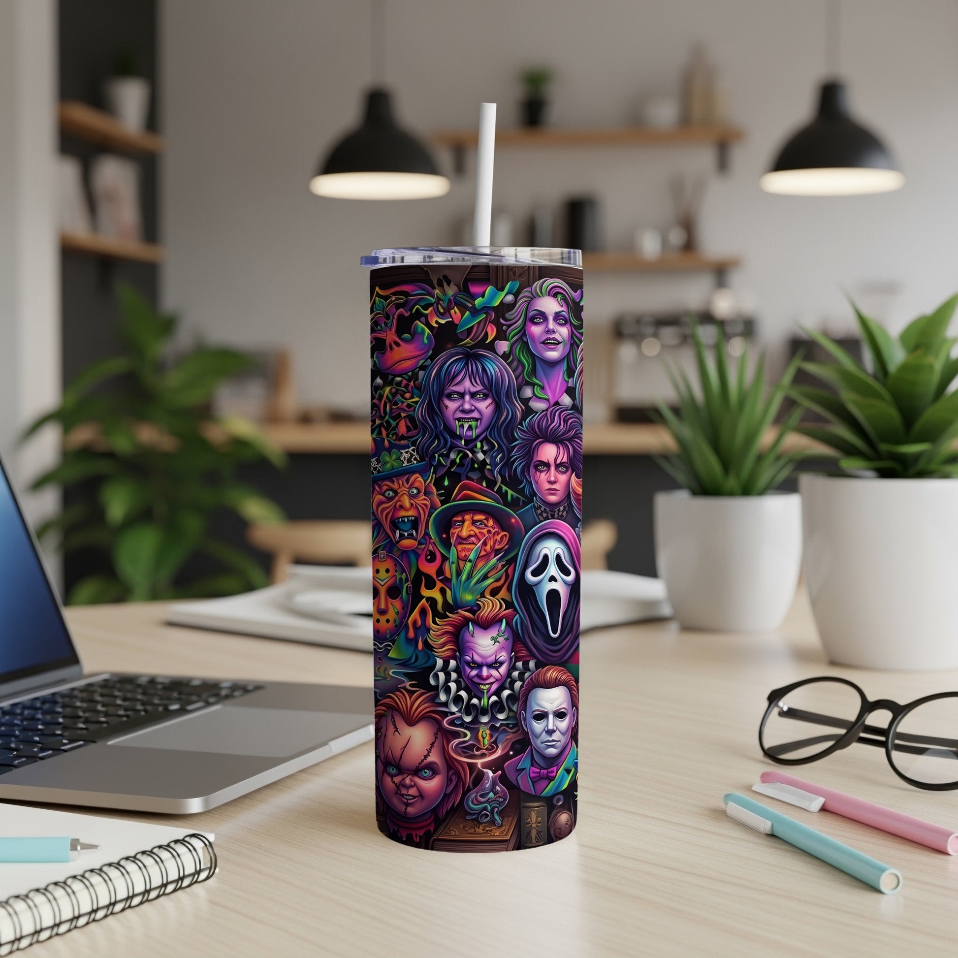Tumbler with collage of horror movie villains and colorful accents.